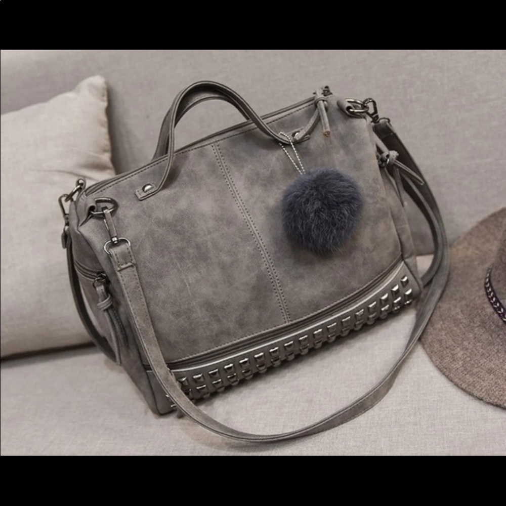 Grey cross body with pompom
